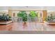 Hallway with tile flooring and tropical plants at 6500 Sunset Way # 311, St Pete Beach, FL 33706