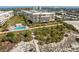 Gorgeous beachfront condo with a sparkling pool and lush tropical landscaping at 6500 Sunset Way # 311, St Pete Beach, FL 33706