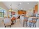 Bright, open dining area adjacent to kitchen, featuring a chandelier, and tile flooring at 6540 Tailfeather Way, Bradenton, FL 34203