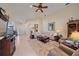 Bright living room with neutral tones, tile floors, and a comfortable seating area at 6540 Tailfeather Way, Bradenton, FL 34203