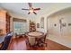 Comfortable sitting area featuring a game table, built-in shelves, and wood flooring at 6540 Tailfeather Way, Bradenton, FL 34203