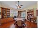 Cozy sitting area with a round game table, built-in shelves, and a view of the window at 6540 Tailfeather Way, Bradenton, FL 34203