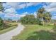 Scenic community path with lush landscaping, beautiful views, and access to neighborhood amenities at 6540 Tailfeather Way, Bradenton, FL 34203