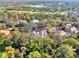 An aerial view of the property, highlighting its proximity to a lush green golf course and a serene lake at 67 Sugar Mill Dr, Osprey, FL 34229