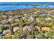 Expansive aerial view captures the neighborhood and ocean and inter-coastal waterway in the background at 67 Sugar Mill Dr, Osprey, FL 34229