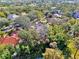 An aerial view featuring the property's location within a lush community with mature trees at 67 Sugar Mill Dr, Osprey, FL 34229