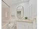 Bright bathroom featuring a marble vanity, and a shower-tub combination at 67 Sugar Mill Dr, Osprey, FL 34229