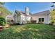 A well-maintained home featuring manicured landscaping and a chimney, creating a cozy and inviting exterior at 67 Sugar Mill Dr, Osprey, FL 34229