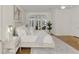 Bright main bedroom featuring a door to the screened pool area and an ornate ceiling fan at 67 Sugar Mill Dr, Osprey, FL 34229