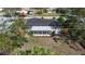 Aerial view of house showcasing sunroom, backyard and surrounding neighborhood at 6705 20Th W Ave, Bradenton, FL 34209