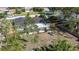 Aerial view of home with a wooden fence and tropical landscaping in the yard at 6705 20Th W Ave, Bradenton, FL 34209