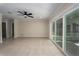 Bright living room with tile floors, crown molding, and sliding doors to the lanai at 6705 20Th W Ave, Bradenton, FL 34209