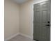 Mud room with tile floors, neutral paint, and door to the garage or backyard at 6705 20Th W Ave, Bradenton, FL 34209