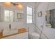 Modern bathroom featuring tile floors, geometric patterns, and an illuminated mirror at 746 Plymouth St, Sarasota, FL 34242