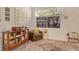 Comfortable living room with accent chair, area rug, and transom window providing natural light at 746 Plymouth St, Sarasota, FL 34242