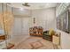 Inviting living room features a leather chair, transom window, and elegant area rug at 746 Plymouth St, Sarasota, FL 34242