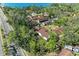 Aerial view of neighborhood surrounded by mature trees, close to water at 7921 4Th W Ave, Bradenton, FL 34209