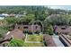 Aerial view of charming home surrounded by lush trees and landscaping in desirable neighborhood at 7921 4Th W Ave, Bradenton, FL 34209