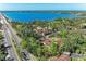 Aerial view showcases the property's proximity to lush greenery and waterfront at 7921 4Th W Ave, Bradenton, FL 34209