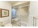 Neutral bathroom featuring a walk-in shower with glass doors and hand rails at 7921 4Th W Ave, Bradenton, FL 34209