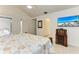 Bedroom with sliding glass door, ceiling fan, flatscreen TV, and closet at 7921 4Th W Ave, Bradenton, FL 34209