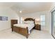 Main bedroom with vaulted ceilings, ceiling fan, and ensuite bath at 7921 4Th W Ave, Bradenton, FL 34209