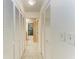 Hallway featuring multiple closets and access to the bathroom at 7921 4Th W Ave, Bradenton, FL 34209