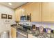 Kitchen with granite countertops, stainless steel appliances, and white subway tile backsplash at 7921 4Th W Ave, Bradenton, FL 34209