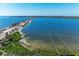 Scenic aerial view of blue water with docks and beach access at 7921 4Th W Ave, Bradenton, FL 34209