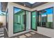 Tranquil courtyard with stepping stones, gravel, lush greenery, and clerestory windows at 8487 Lindrick Ln, Bradenton, FL 34202