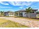 Striking home with stone accents, palm trees, and a welcoming driveway at 8487 Lindrick Ln, Bradenton, FL 34202