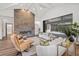 Bright and airy living room featuring a fireplace, comfortable seating, and sliding glass doors to outdoor area at 8487 Lindrick Ln, Bradenton, FL 34202