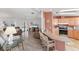 Living room and kitchen featuring wood floors, neutral decor, and barstool seating at 8536 Countess Avenue Cir, Palmetto, FL 34221