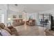 Inviting living room featuring wood floors, neutral decor, and sliding glass doors at 8536 Countess Avenue Cir, Palmetto, FL 34221