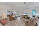 Cozy living room with wood floors, ceiling fan and plenty of natural light at 8536 Countess Avenue Cir, Palmetto, FL 34221