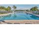 Enjoy the community pool with lake views and ample seating, perfect for relaxation and socializing at 8536 Countess Avenue Cir, Palmetto, FL 34221