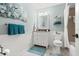 Bright bathroom featuring a vanity with storage and decorative accessories at 866 Audubon Dr, Bradenton, FL 34209