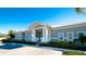 Exterior of the community clubhouse with a covered entry and well-maintained landscaping at 866 Audubon Dr, Bradenton, FL 34209