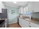 Well-lit kitchen features granite countertops, stainless steel appliances, and bright white cabinets at 866 Audubon Dr, Bradenton, FL 34209