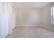 Bright bedroom featuring tile floors, a window and a closet at 9590 Knightsbridge Cir, Sarasota, FL 34238