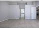 Spacious room with tile floors, leading to a bathroom with dual sinks and lots of counterspace at 9590 Knightsbridge Cir, Sarasota, FL 34238