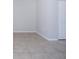 A neutral empty room with tile flooring, perfect for customization at 9590 Knightsbridge Cir, Sarasota, FL 34238