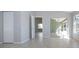 Open, airy room showcasing light tile flooring, with lots of natural light at 9590 Knightsbridge Cir, Sarasota, FL 34238