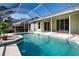 Screened pool featuring sunny turquoise water and patio, perfect for outdoor living at 9590 Knightsbridge Cir, Sarasota, FL 34238