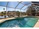 Screened-in pool with water view provides an ideal space for relaxation and recreation at 9590 Knightsbridge Cir, Sarasota, FL 34238