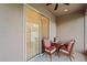 Cozy balcony area, furnished with comfortable wicker seating, perfect for relaxation or enjoying the outdoors at 1038 Grantham Dr, Sarasota, FL 34234