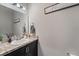 Half bathroom with marble vanity and contemporary decor at 1038 Grantham Dr, Sarasota, FL 34234