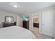 Bedroom featuring a TV and an ensuite bathroom at 1038 Grantham Dr, Sarasota, FL 34234