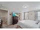 Spacious bedroom with TV, ensuite access, and ample natural light at 1038 Grantham Dr, Sarasota, FL 34234