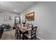 Dining room featuring a painting and display case with seating for four at 1038 Grantham Dr, Sarasota, FL 34234